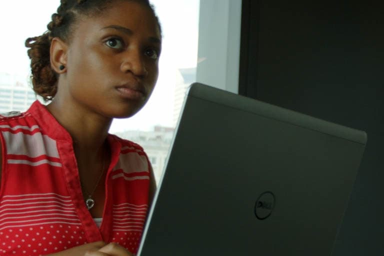 iDEW student working on laptop